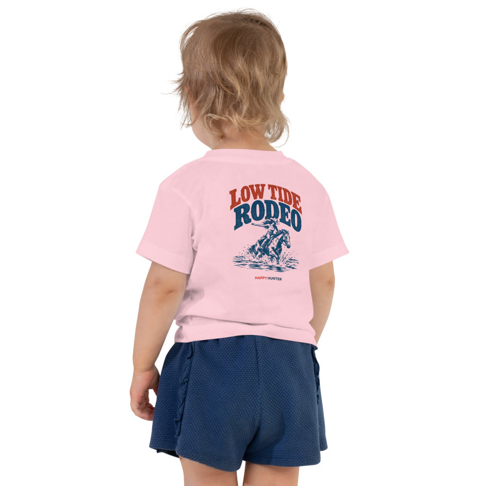 Low Tide Rodeo Toddler Tee - Pink - on a toddler