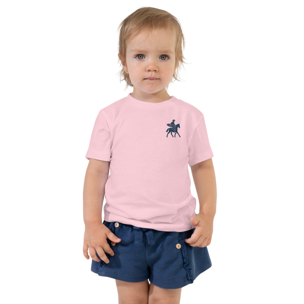 Low Tide Rodeo Toddler Tee - Pink - on a toddler